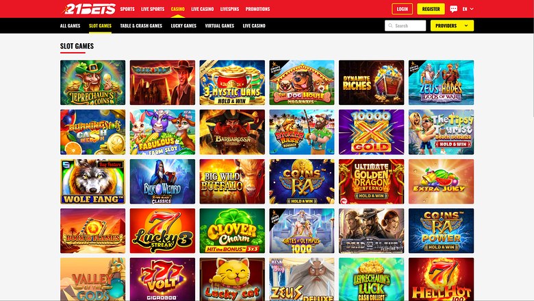 A 21BETS online casino lobby showing a grid of slot game tiles under a red header with login and register buttons.