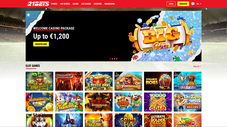 A 21BETS casino lobby screenshot showing a welcome bonus banner and a grid of slot game tiles.