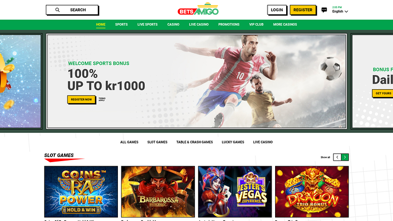 A BetAmigo casino homepage showing a sports welcome bonus hero banner, a top navigation bar, and a row of slot game tiles.