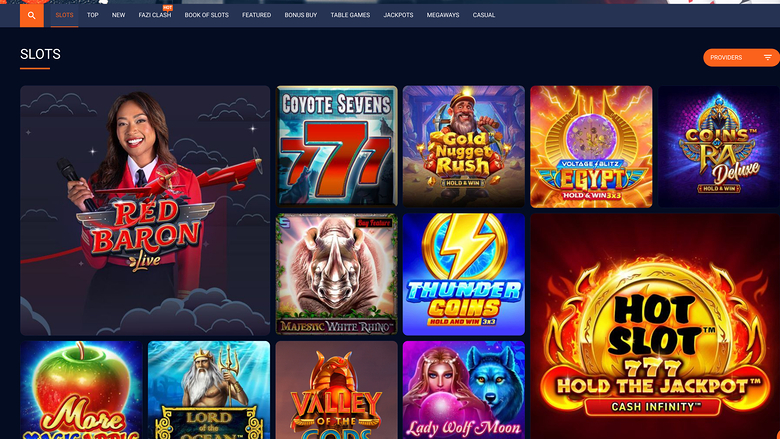 A slots lobby page on an online casino site showing a grid of game tiles under a 'SLOTS' heading with a top navigation bar.