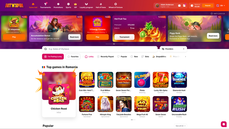 A desktop online casino lobby titled Hit'n'Spin shows a promotional carousel above a search bar, category tabs and a grid of game tiles.