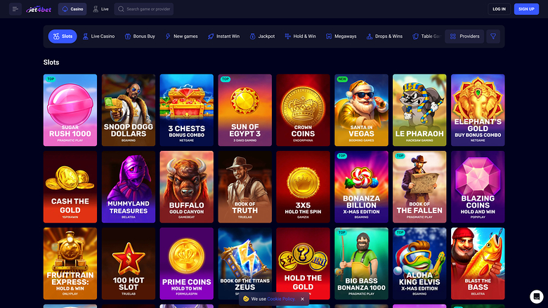 An online casino slots lobby page showing a grid of game tiles under a top navigation bar.