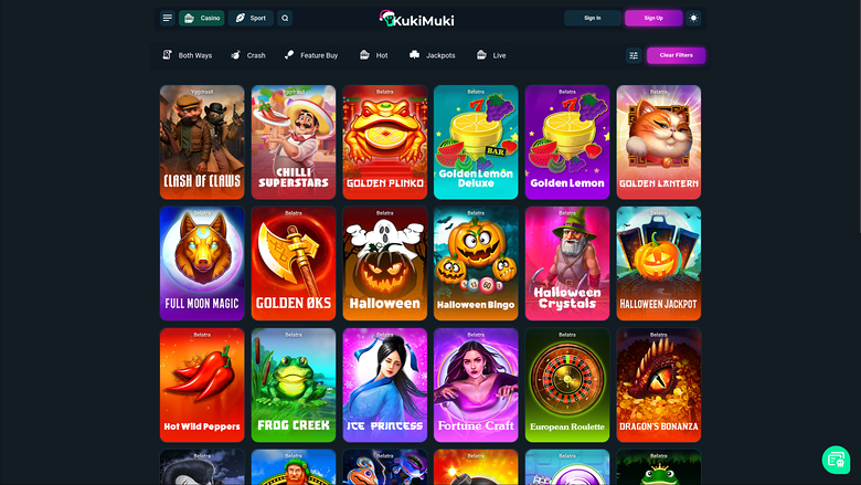 A dark-themed online casino lobby showing a grid of game tiles under a KukiMuki header with category filters and Sign In/Sign Up buttons.